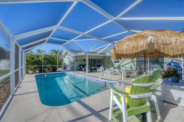 a view of a swimming pool with a patio