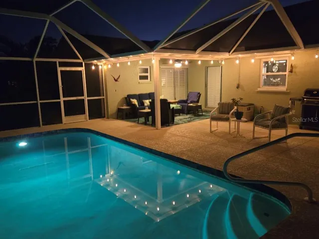 a view of a chairs and table in patio