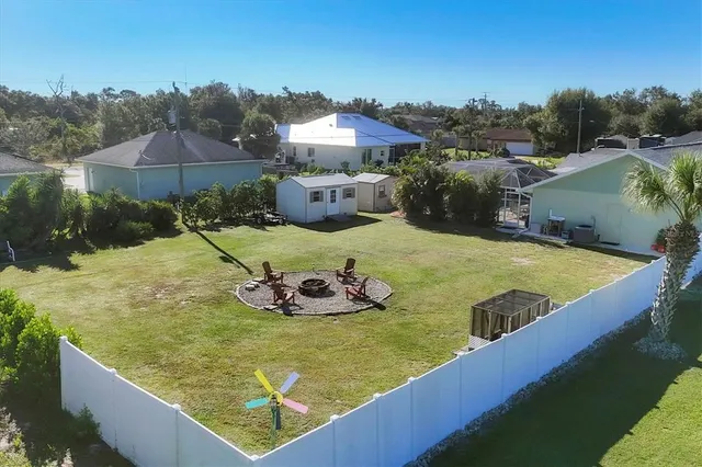 a house view with swimming pool in front of it