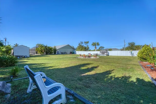 a view of backyard with a garden and entertaining space