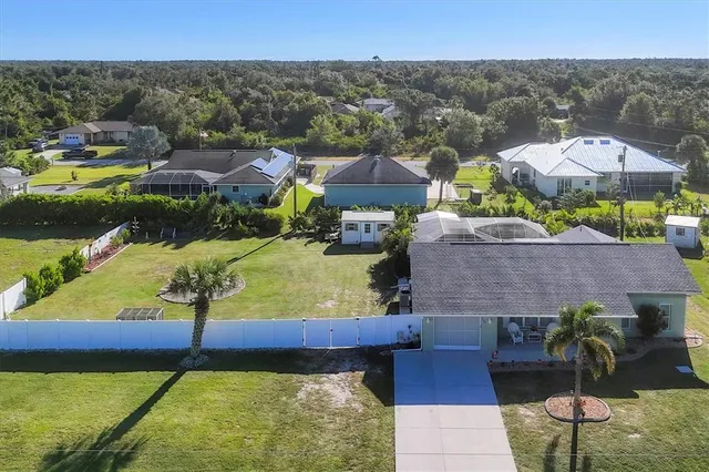 an aerial view of a house with a ocean view