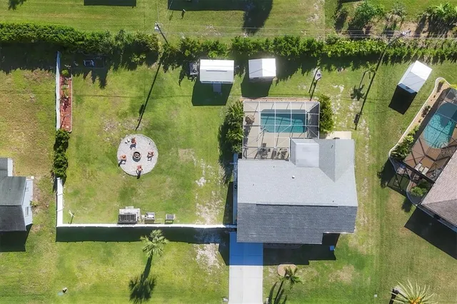 an aerial view of residential houses with outdoor space