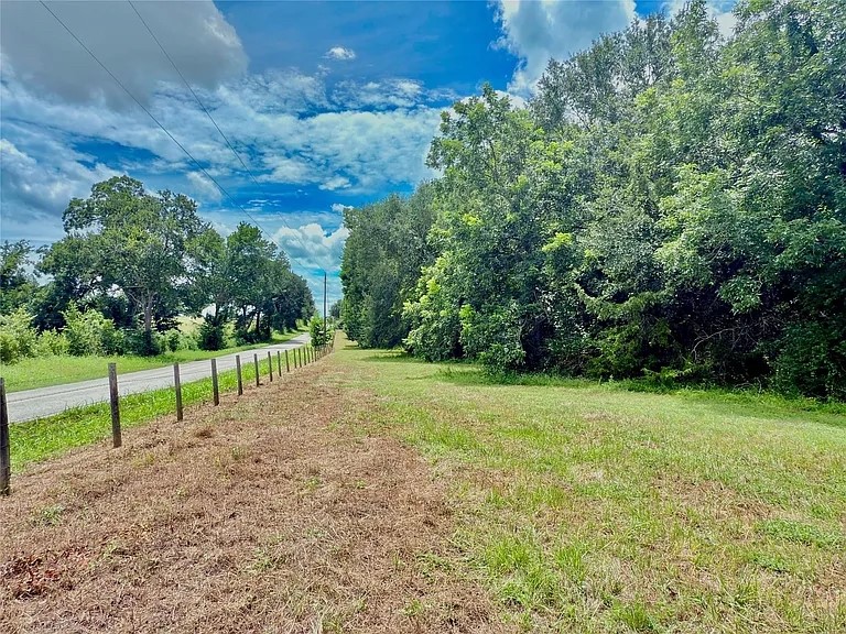 0 Flewellen Road Brenham, TX 77833 - Photo 2 of 6 a view of a field with trees in the background