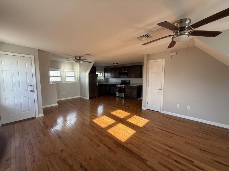629 Highland Avenue, Unit 3 Fall River, MA 02720 - Photo 2 of 8 a view of livingroom with furniture and wooden floor
