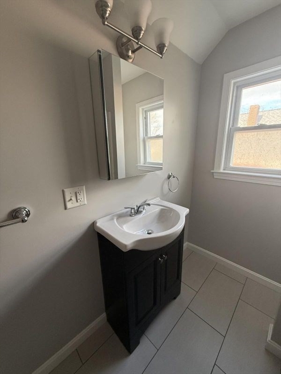 629 Highland Avenue, Unit 3 Fall River, MA 02720 - Photo 6 of 8 a sink and mirror with window