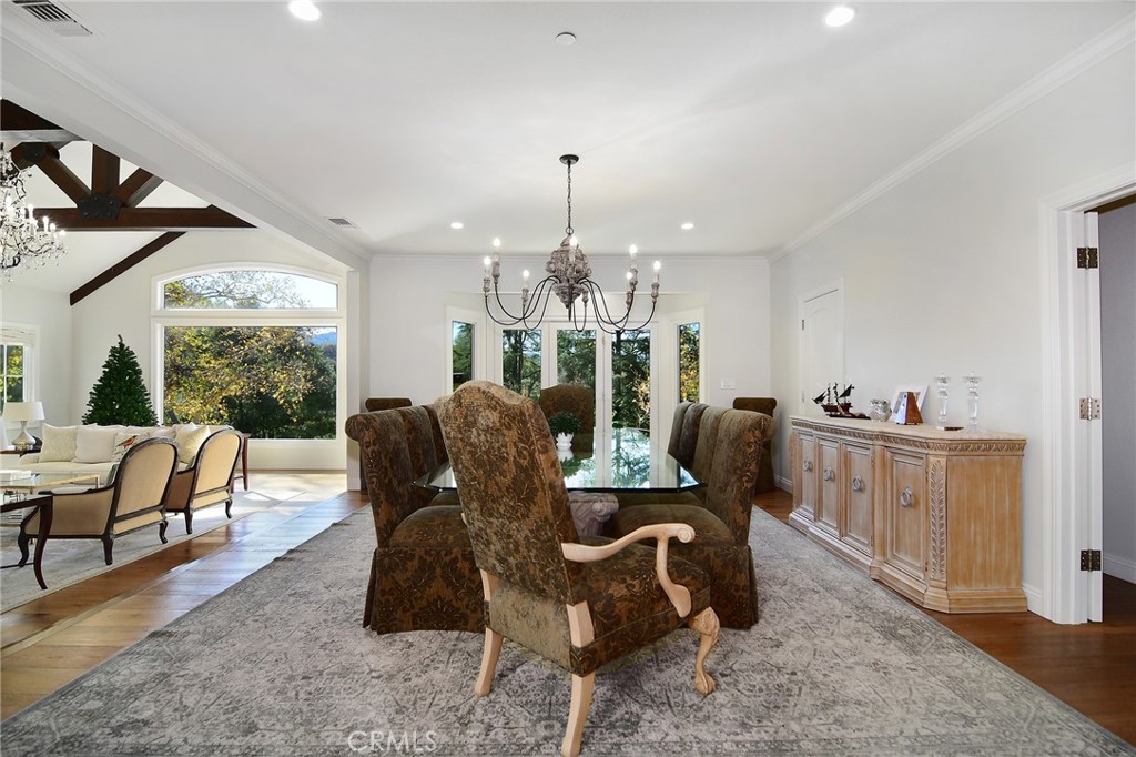 28600 Wagon Road Agoura Hills, CA 91301 - Photo 13 of 44 a living room with furniture a dining table and a fireplace