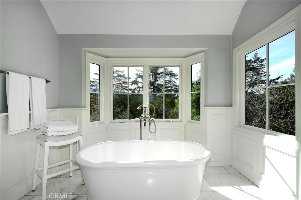 28600 Wagon Road Agoura Hills, CA 91301 - Photo 22 of 44 a white bath tub sitting in a bathroom next to a window