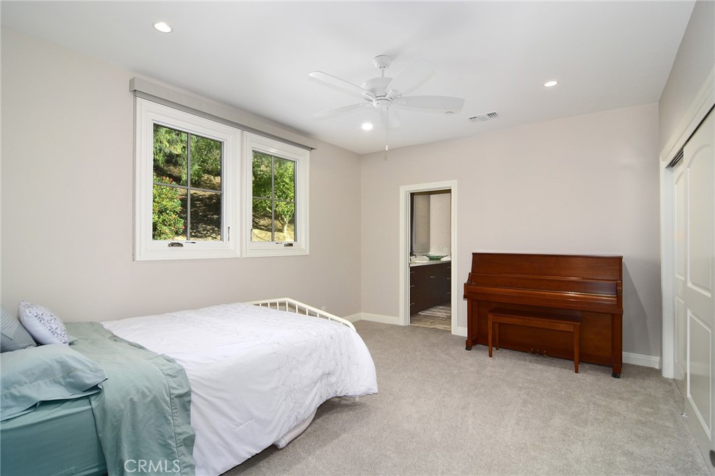 28600 Wagon Road Agoura Hills, CA 91301 - Photo 29 of 44 a bedroom with a bed and a window