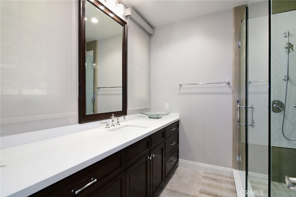 28600 Wagon Road Agoura Hills, CA 91301 - Photo 30 of 44 a bathroom with a sink and a mirror