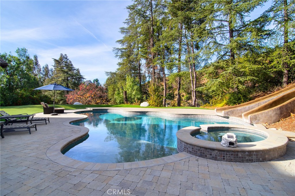 28600 Wagon Road Agoura Hills, CA 91301 - Photo 37 of 44 a view of a swimming pool with sitting area