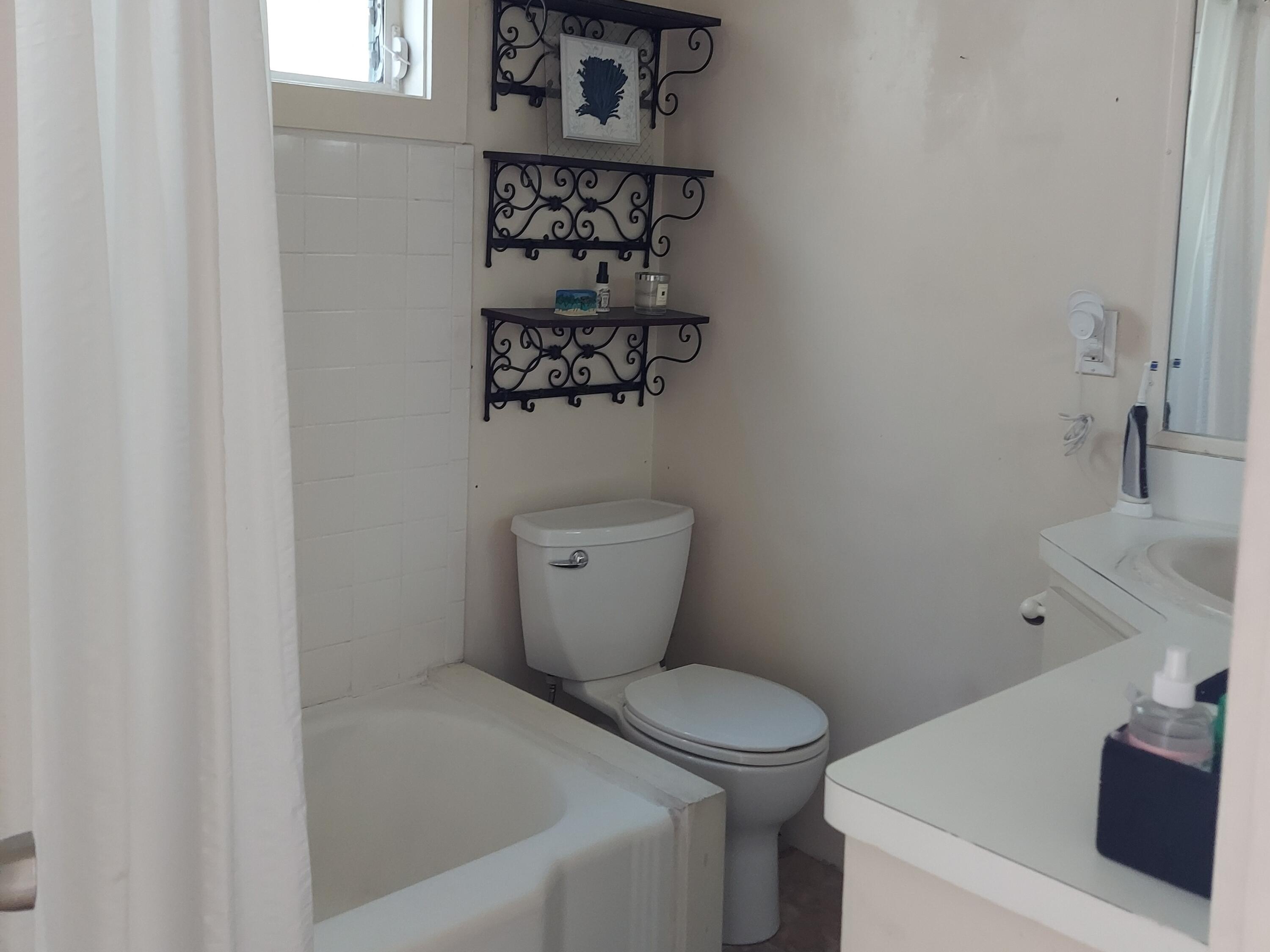 315 William Street Key West, FL 33040 - Photo 15 of 19 a bathroom with a toilet and a sink