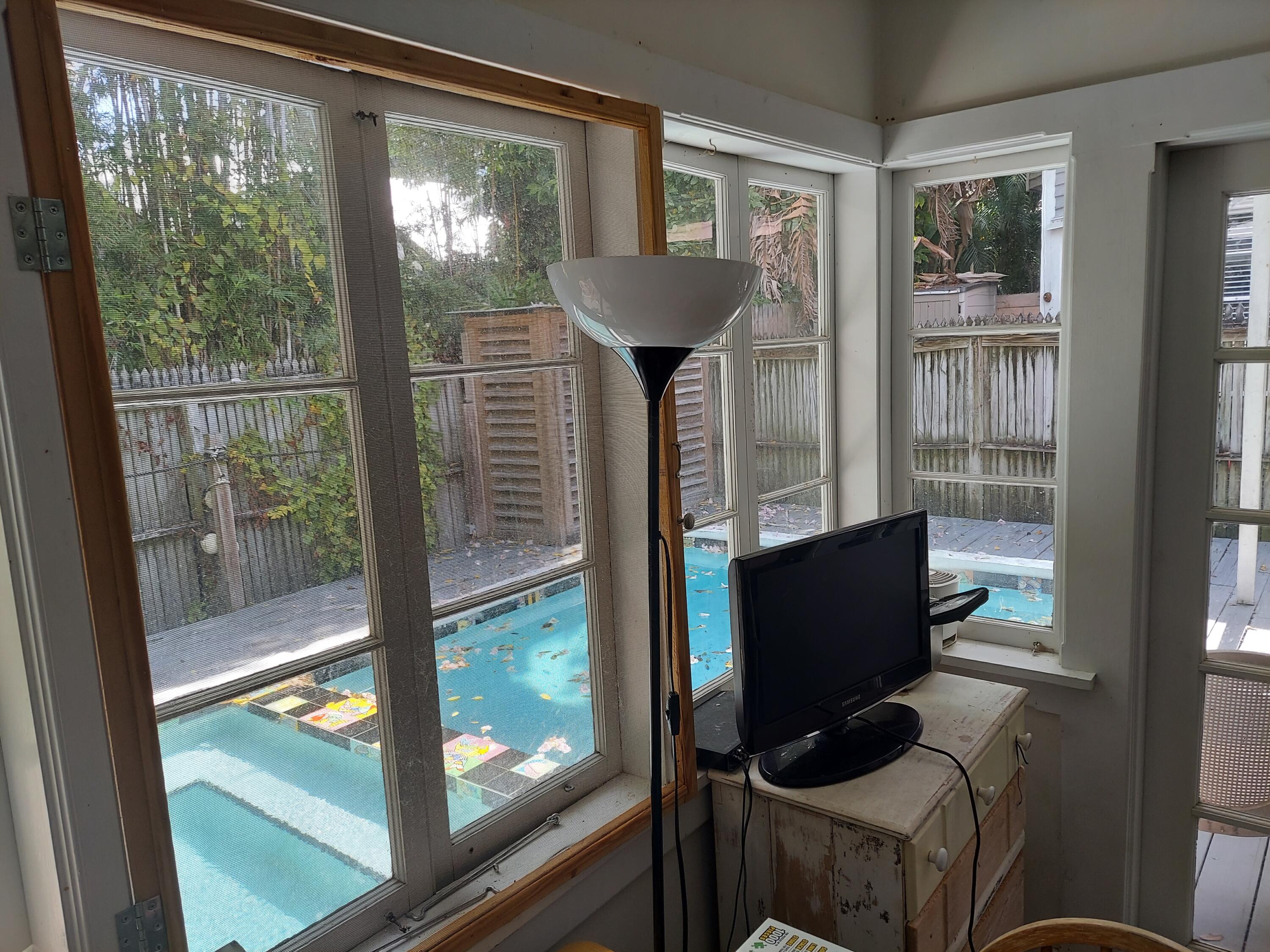 315 William Street Key West, FL 33040 - Photo 7 of 19 a living room with furniture and a window