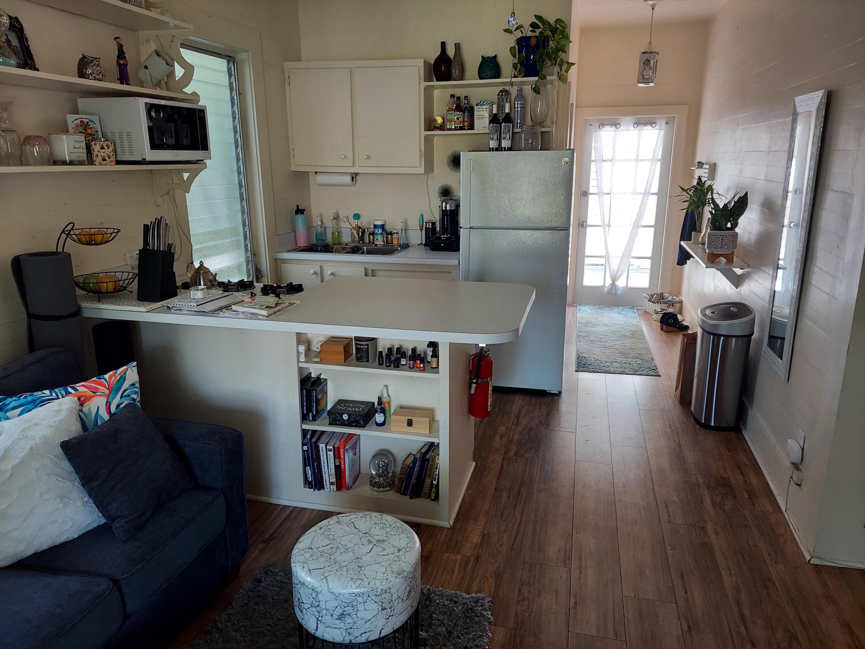315 William Street Key West, FL 33040 - Photo 10 of 19 a living room with furniture and a wooden floor