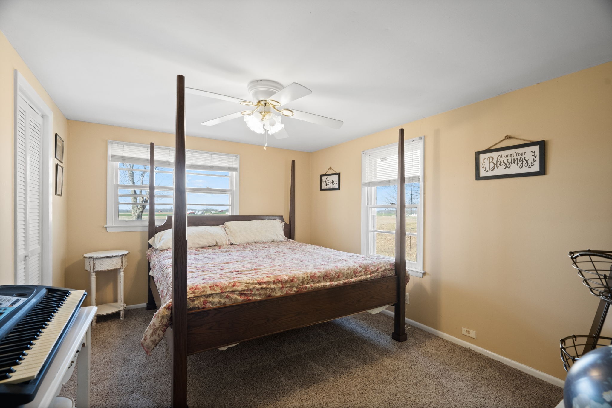 5915 Keysburg Road Adams, TN 37010 - Photo 20 of 26 a bed room with a bed and a chandelier