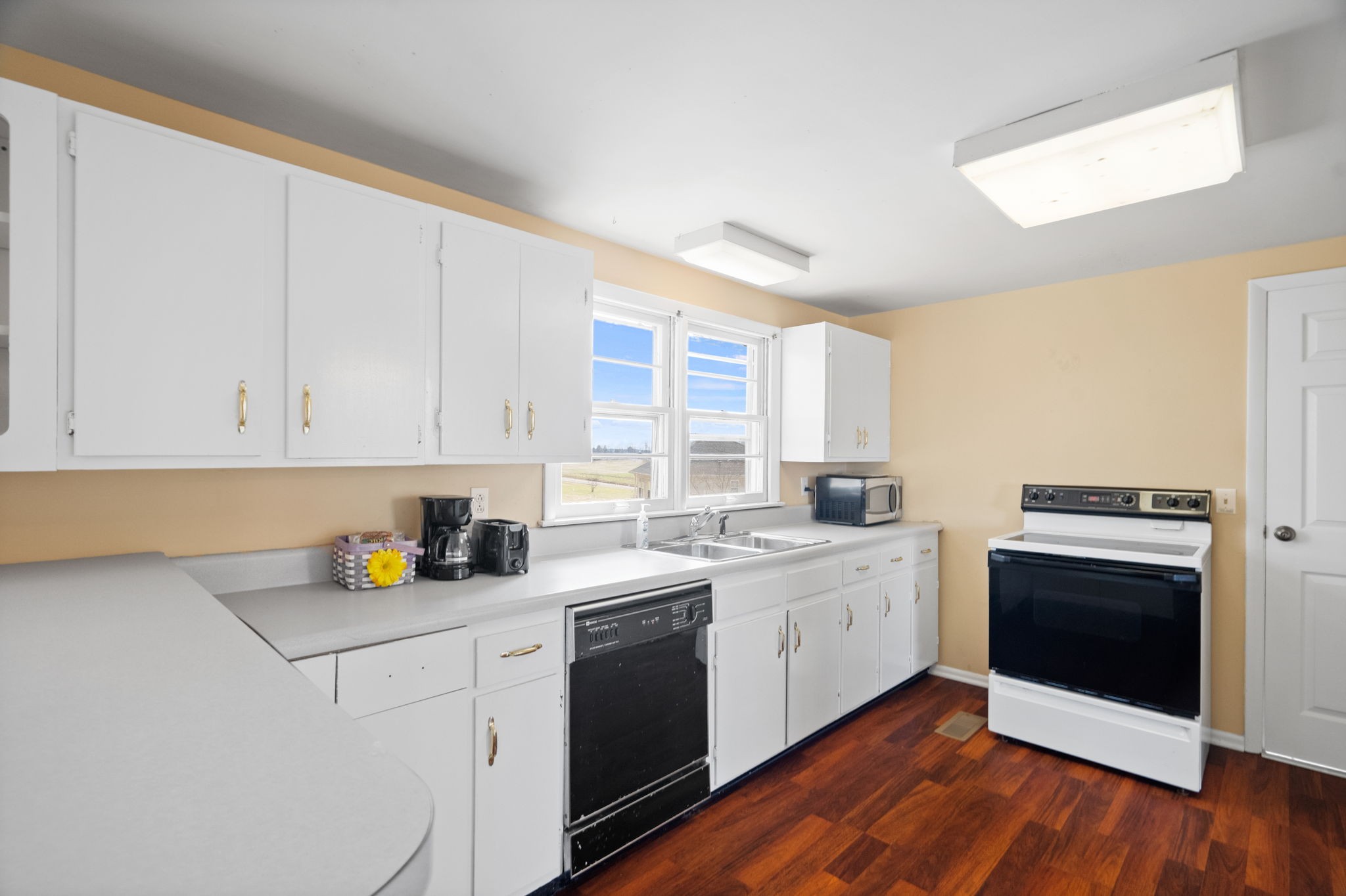 5915 Keysburg Road Adams, TN 37010 - Photo 5 of 26 a kitchen with a sink stove and cabinets