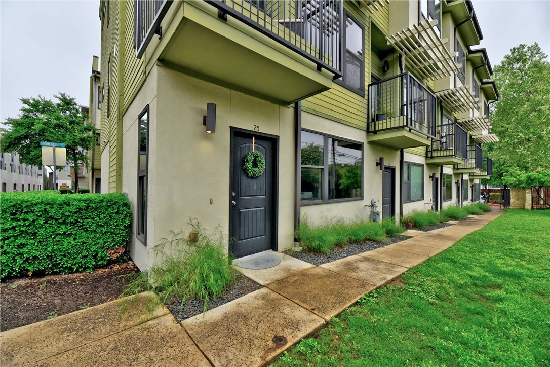 304 West Alpine Road, Unit 25 Austin, TX 78704 - Photo 1 of 1 a view of a brick house with a yard and plants