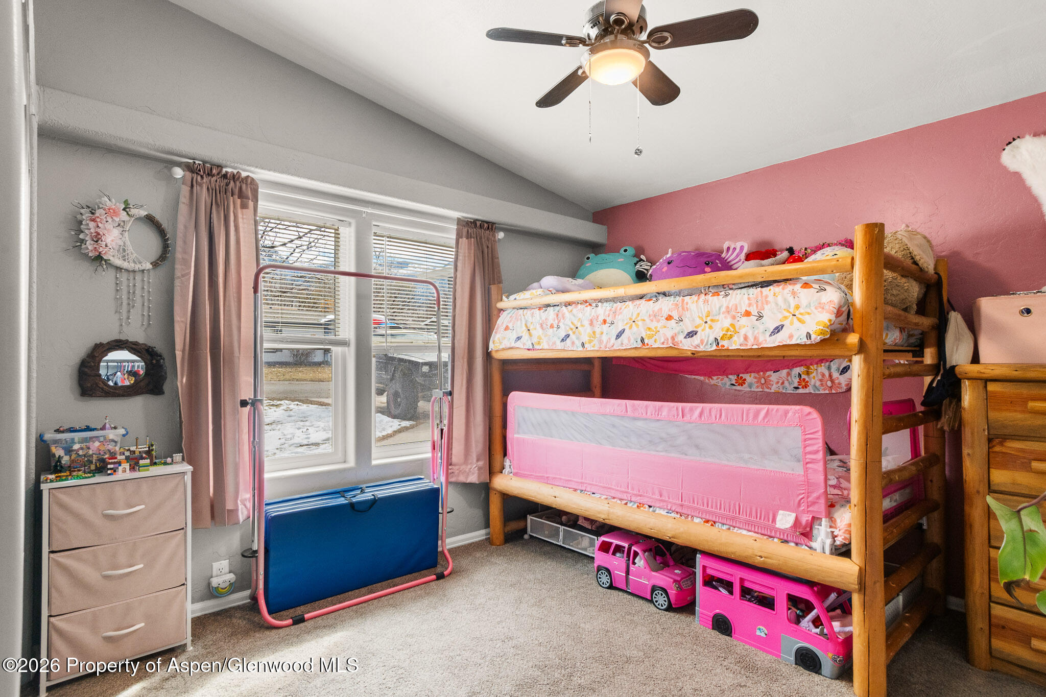 106 Cedar Circle Parachute, CO 81635 - Photo 17 of 35 a bed room with a bed and a window