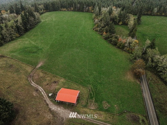 2 Oppelt Road Chehalis, WA 98532 - Photo 6 of 11 a view of a yard with table chairs and a lake view