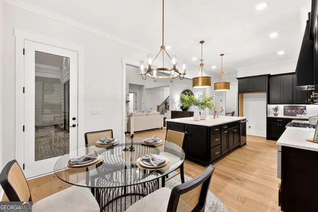 a living room with furniture a fireplace and a large window