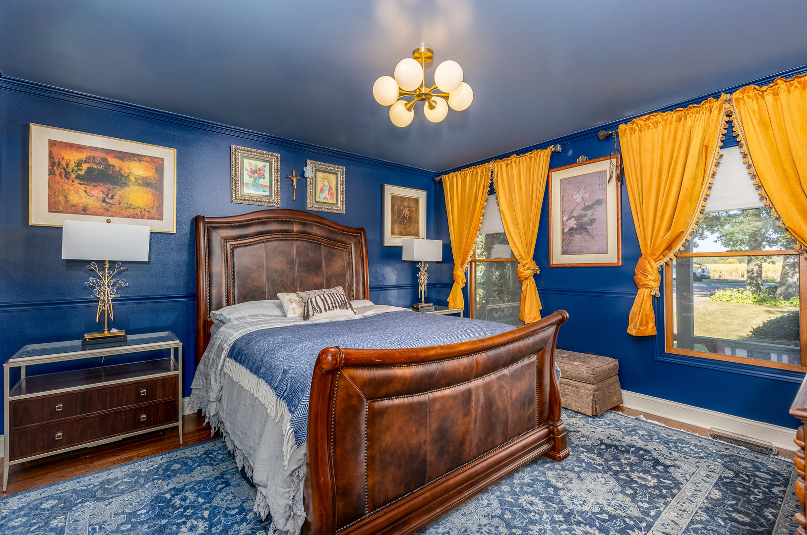 2115 East 875th Road Tonica, IL 61370 - Photo 13 of 33 a bedroom with a bed and a chandelier