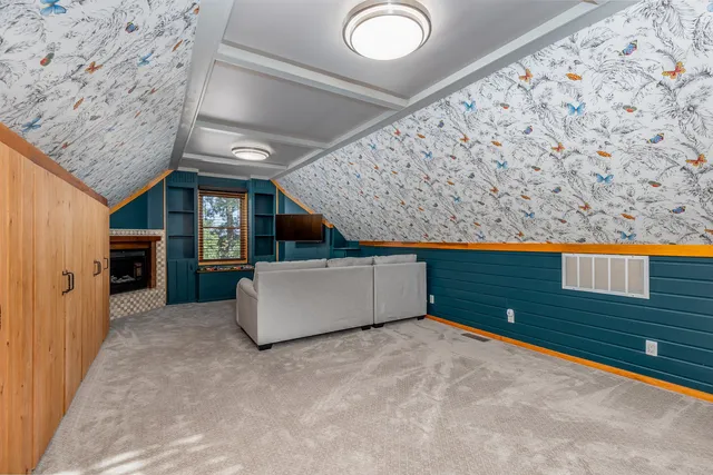 a view of an empty room and window with wooden floor