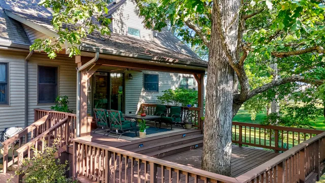 a view of a chair and tables in the balcony