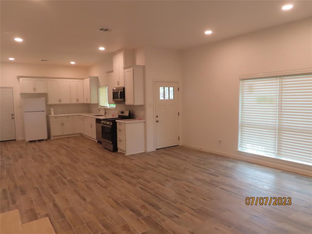 403 High Ridge Street Houston, TX 77013 - Photo 6 of 13 a view of a kitchen with a sink and microwave