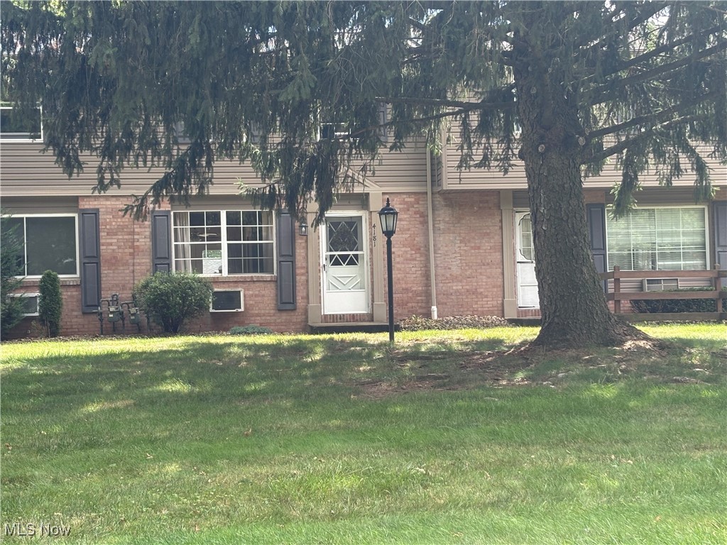 4181 New Road Youngstown, OH 44515 - Photo 1 of 11 View of front of house with a front yard and brick siding