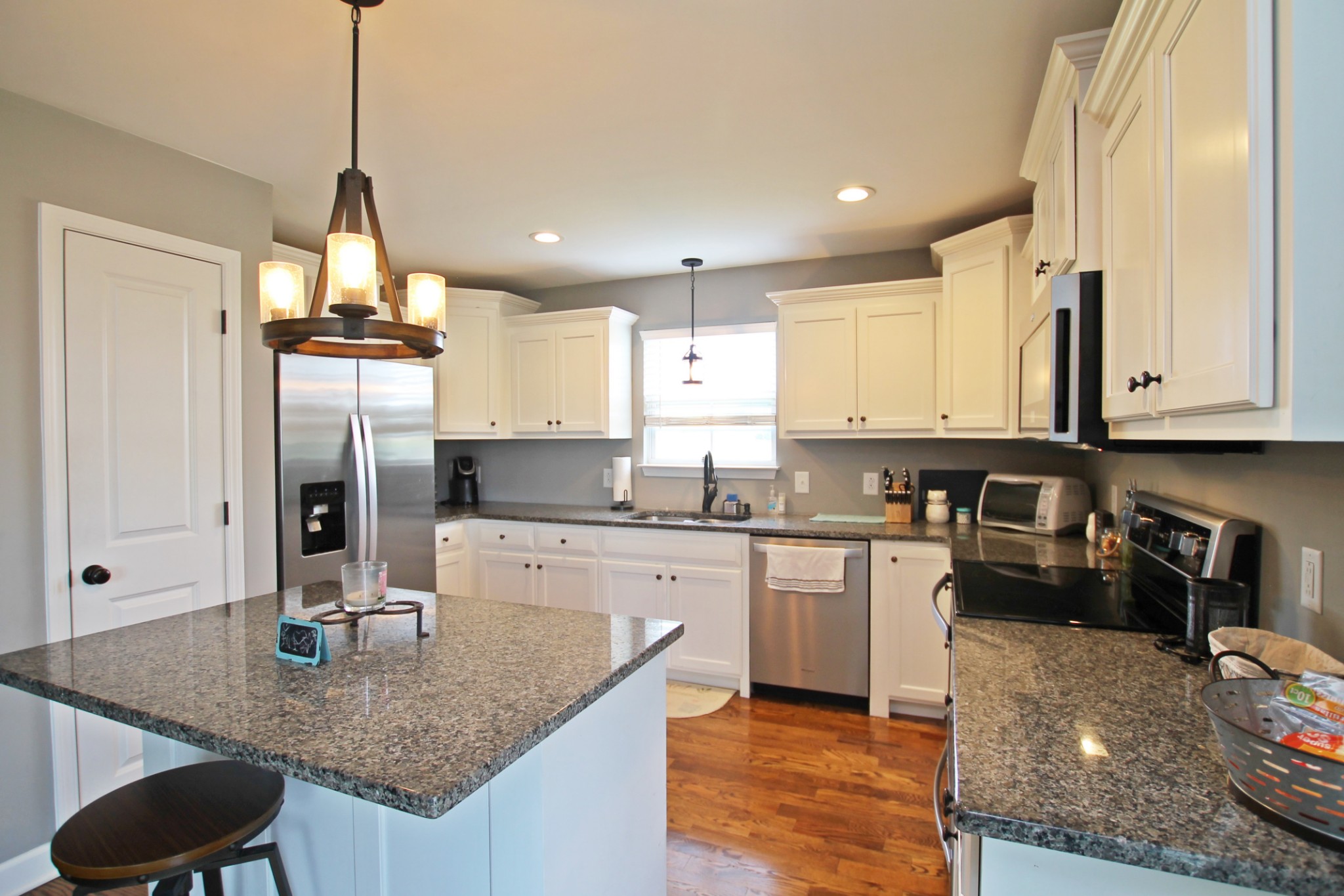 5191 Rippy Road Cross Plains, TN 37049 - Photo 11 of 48 a kitchen with stainless steel appliances granite countertop a sink stove and refrigerator