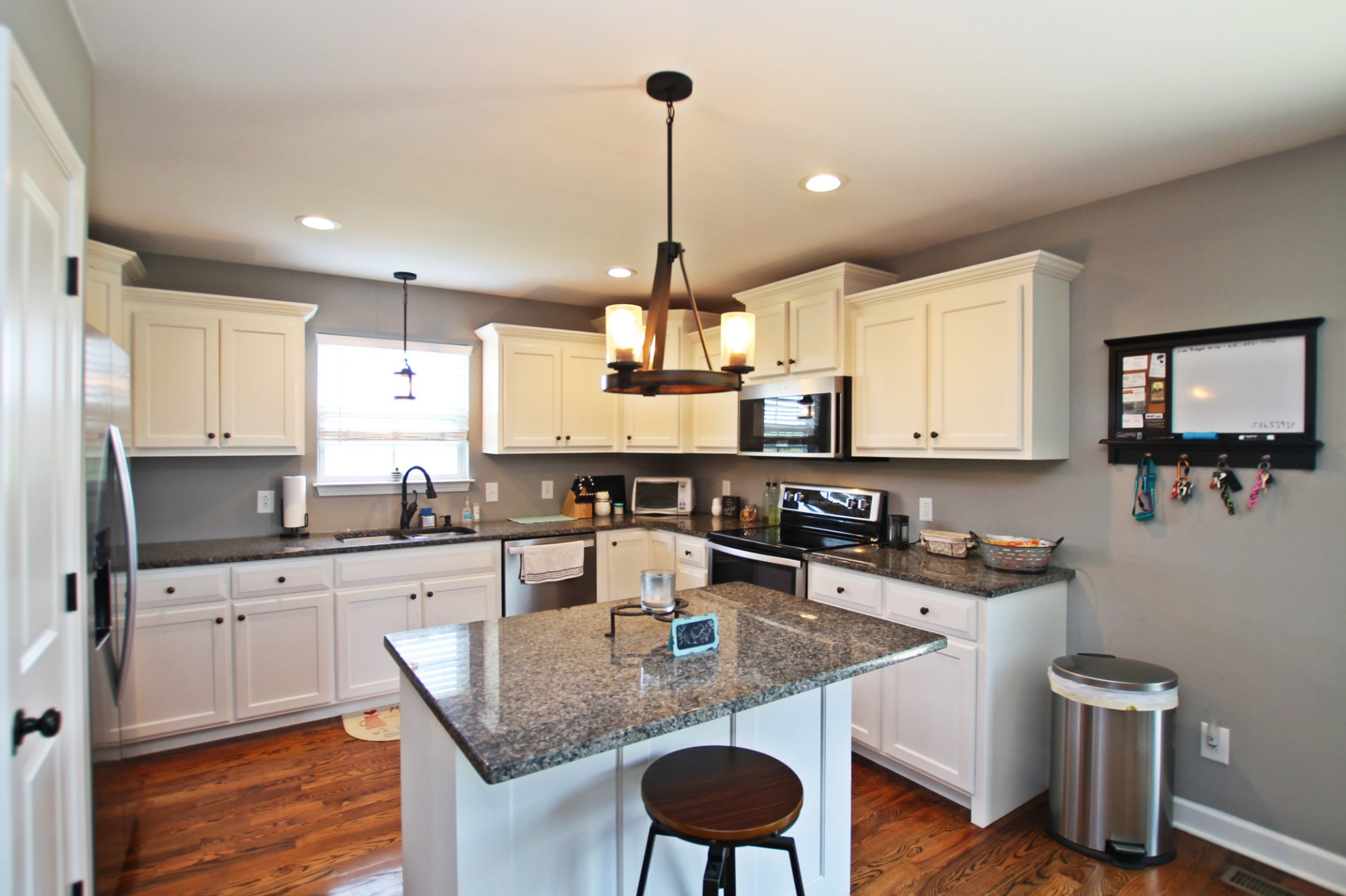 5191 Rippy Road Cross Plains, TN 37049 - Photo 12 of 48 a kitchen with kitchen island granite countertop a sink a counter space appliances and cabinets