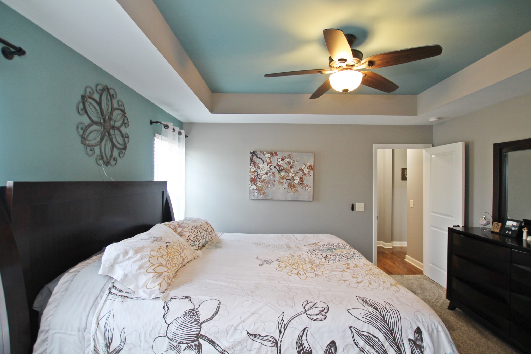 5191 Rippy Road Cross Plains, TN 37049 - Photo 18 of 48 a bedroom with a bed and a chandelier