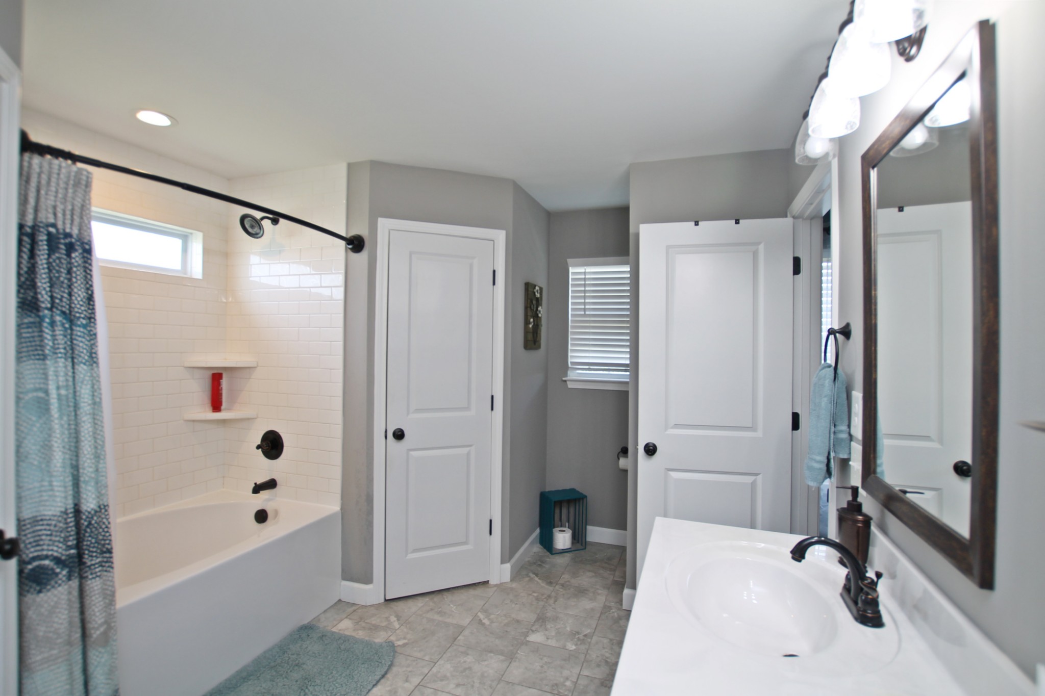 5191 Rippy Road Cross Plains, TN 37049 - Photo 21 of 48 a bathroom with a tub shower sink and mirror