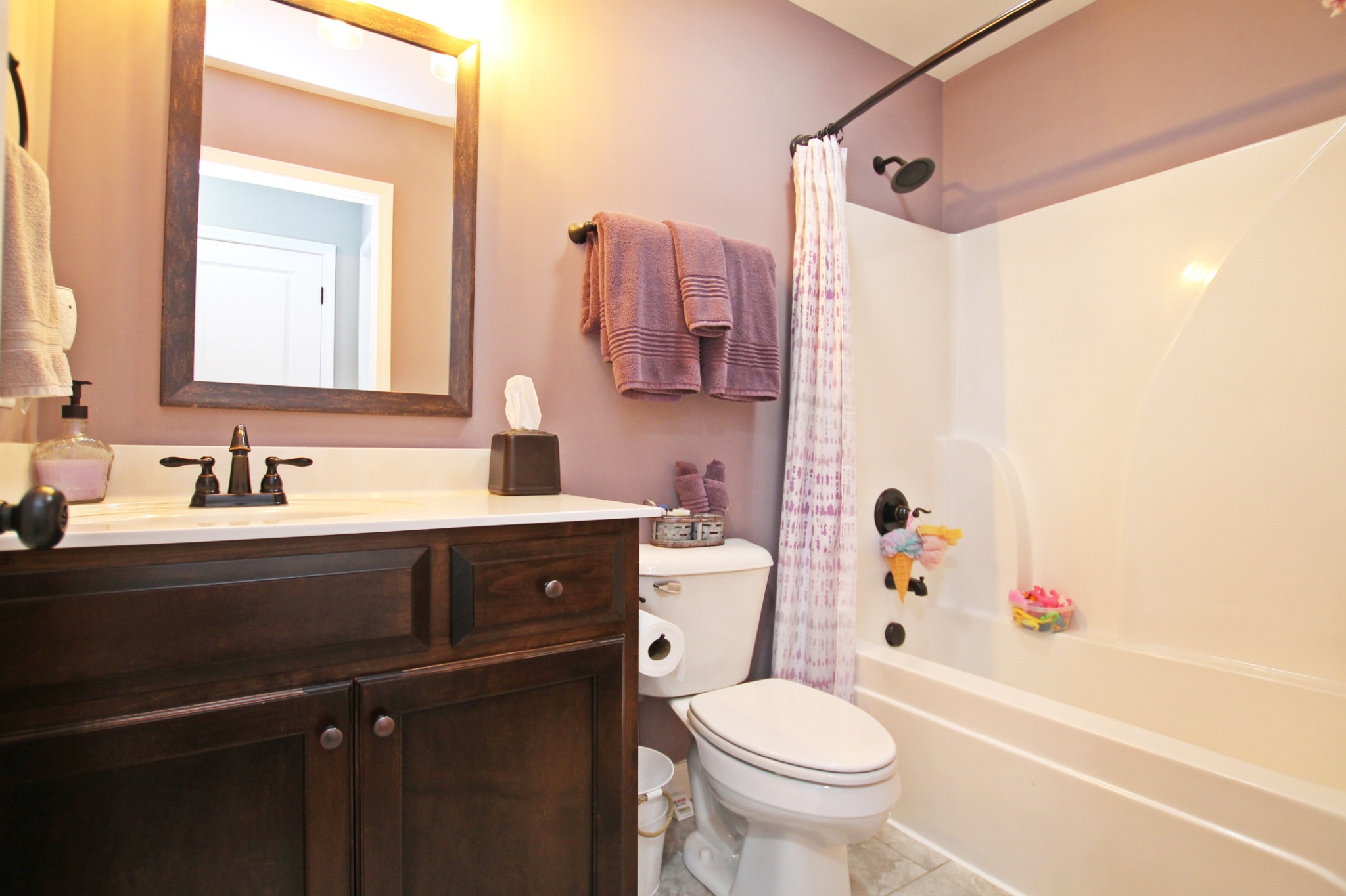 5191 Rippy Road Cross Plains, TN 37049 - Photo 30 of 48 a bathroom with a sink a toilet and a mirror