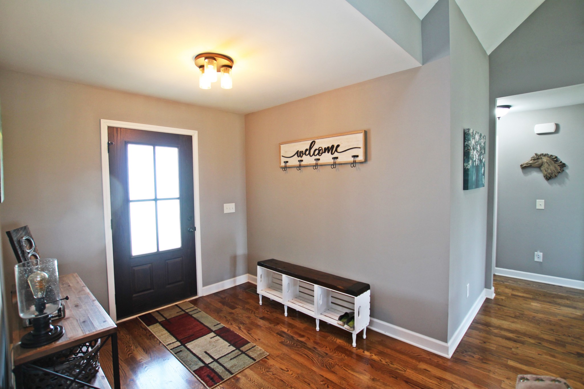 5191 Rippy Road Cross Plains, TN 37049 - Photo 34 of 48 a room with chair and wooden floor