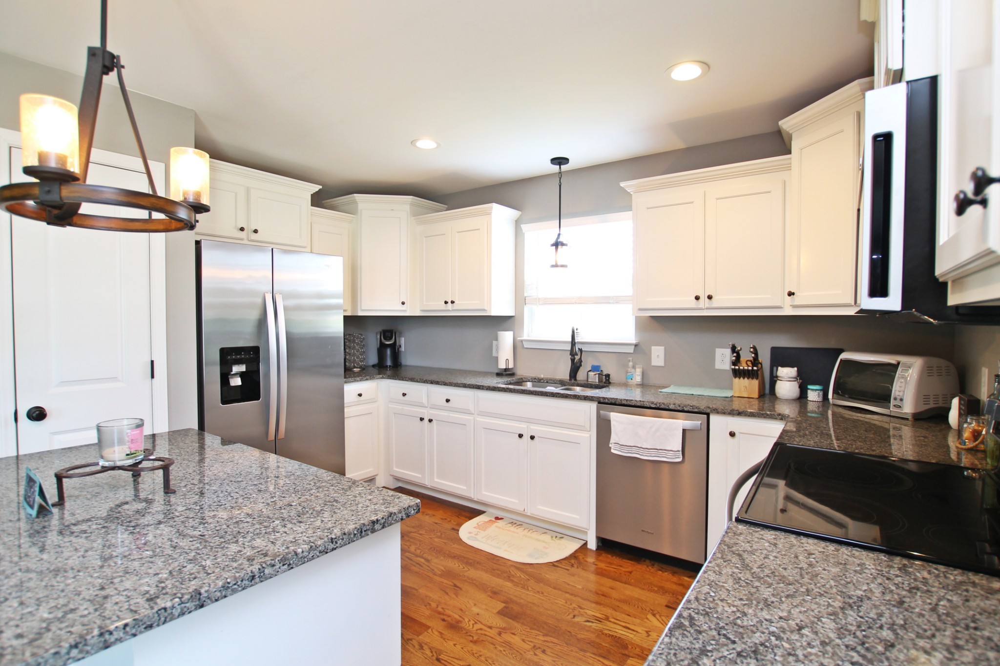 5191 Rippy Road Cross Plains, TN 37049 - Photo 8 of 48 a kitchen with stainless steel appliances granite countertop a sink refrigerator and cabinets