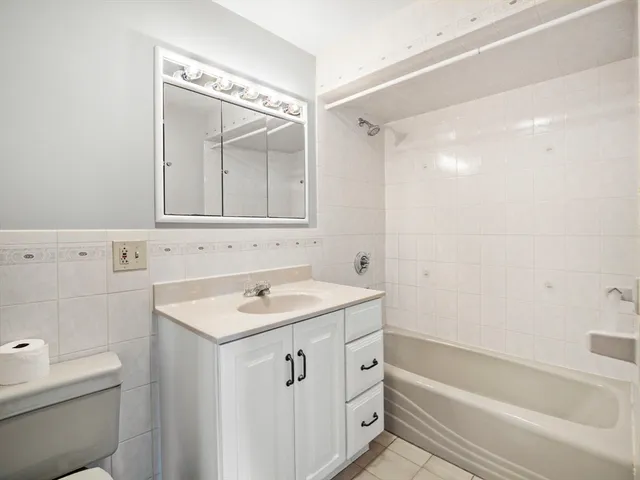a view of a balcony with wooden floor and fence