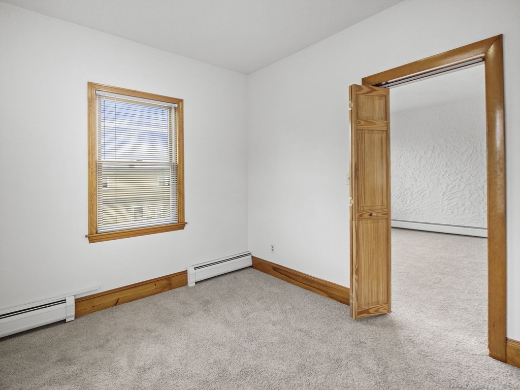69 Stowers Street, Unit 2 Revere, MA 02151 - Photo 7 of 17 a view of an empty room with a window