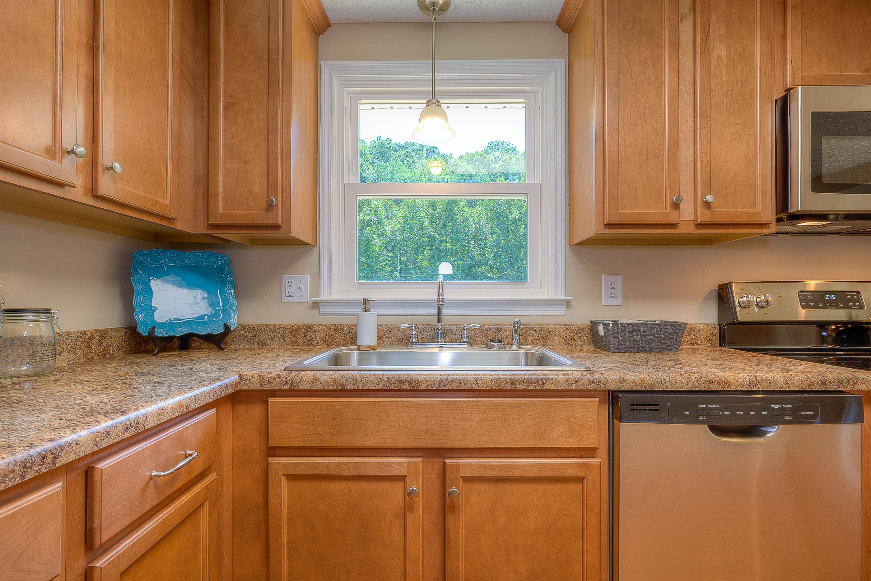 2509 Rutrough Road Southeast Roanoke, VA 24014 - Photo 12 of 28 a kitchen with granite countertop stainless steel appliances white cabinets and a window