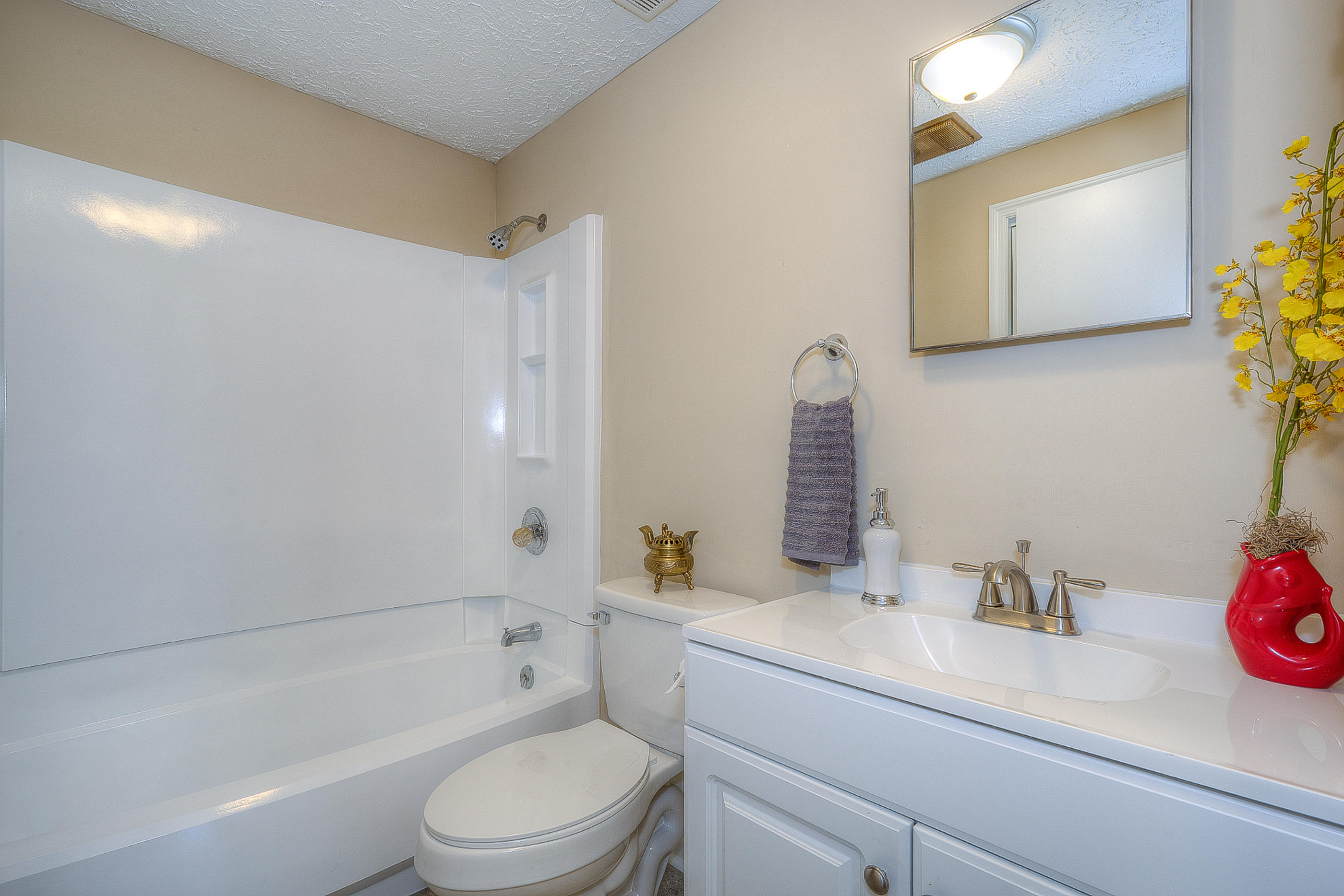2509 Rutrough Road Southeast Roanoke, VA 24014 - Photo 20 of 28 a bathroom with a granite countertop sink a toilet and shower
