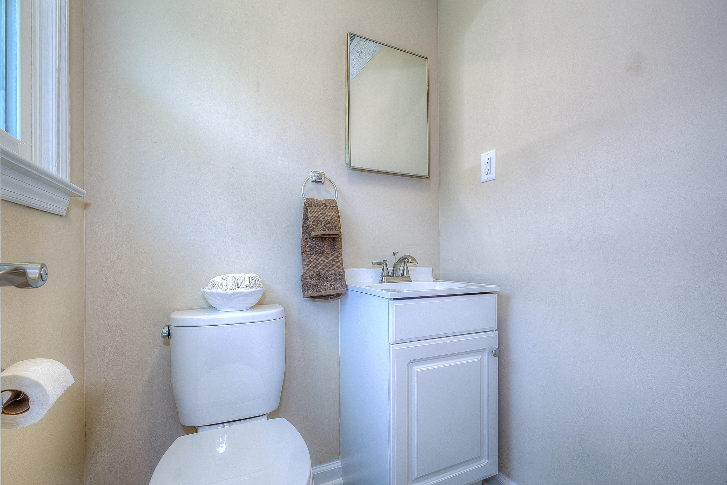2509 Rutrough Road Southeast Roanoke, VA 24014 - Photo 22 of 28 a bathroom with a toilet sink and mirror