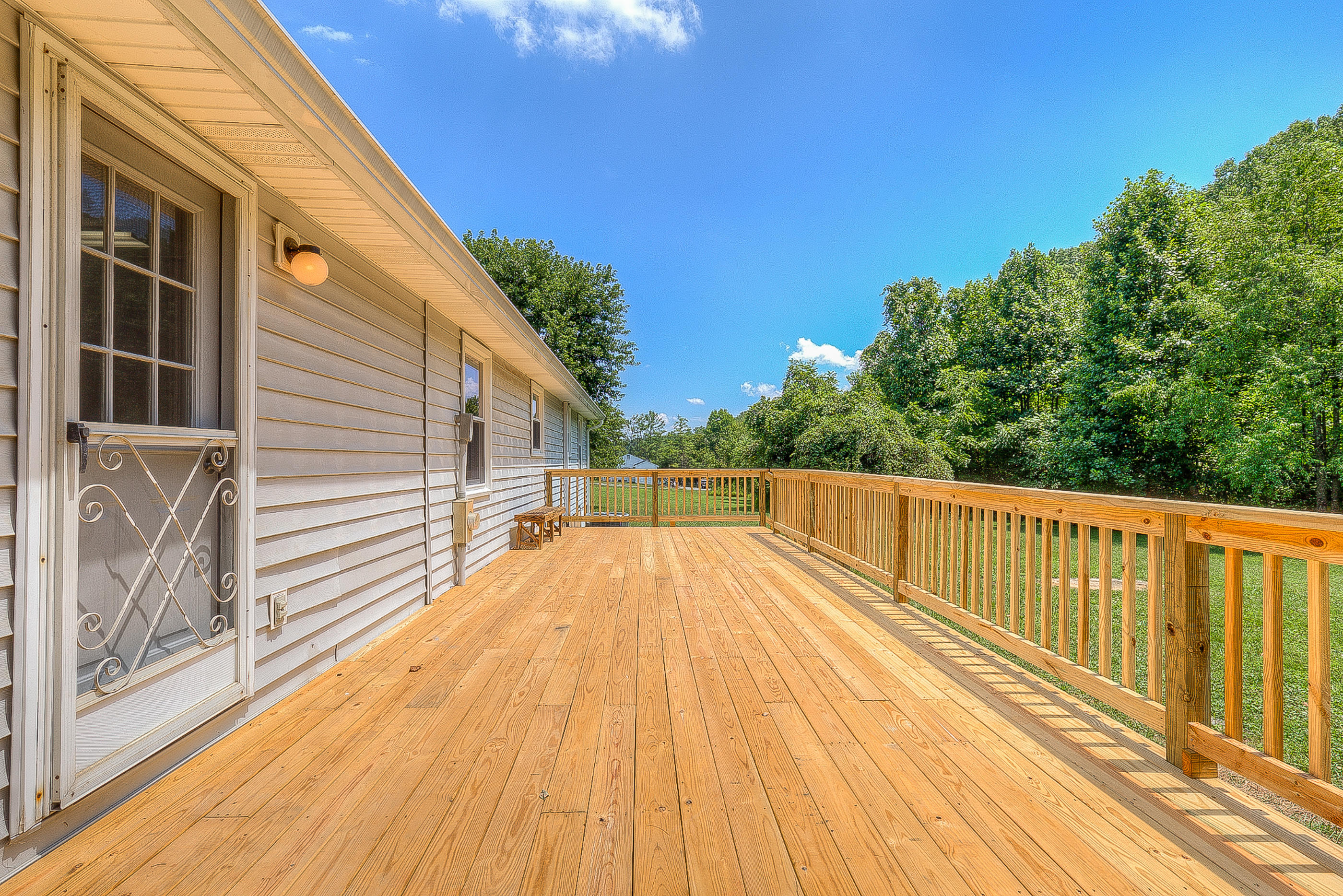 2509 Rutrough Road Southeast Roanoke, VA 24014 - Photo 26 of 28 a view of balcony with wooden floor and fence