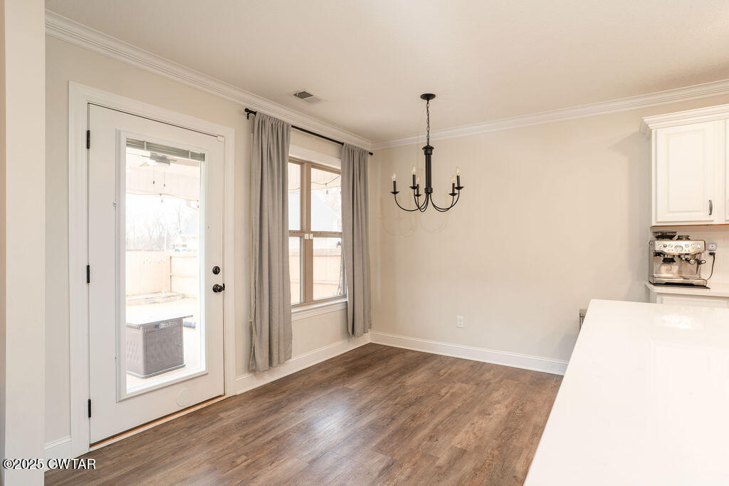 104 Springview Cove Medina, TN 38355 - Photo 17 of 37 a view of a room with wooden floor and windows