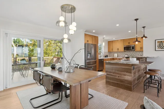 a kitchen with stainless steel appliances granite countertop a sink and stove