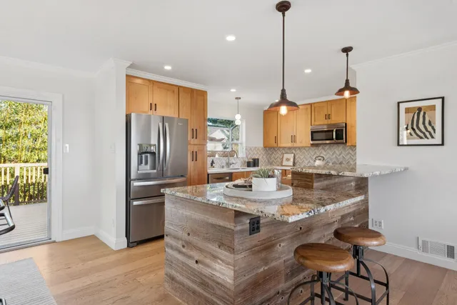 a kitchen with a sink stove and microwave