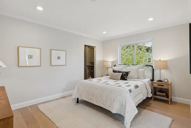 a bathroom with a double vanity sink toilet and mirror