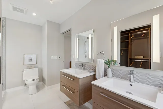 a bedroom with a large bed and a large window