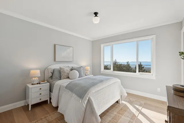 a bathroom with a sink mirror and a bathtub