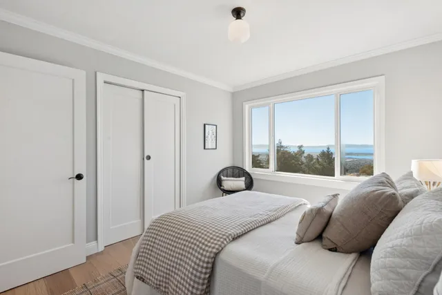 a view of a patio with table and chairs and wooden fence