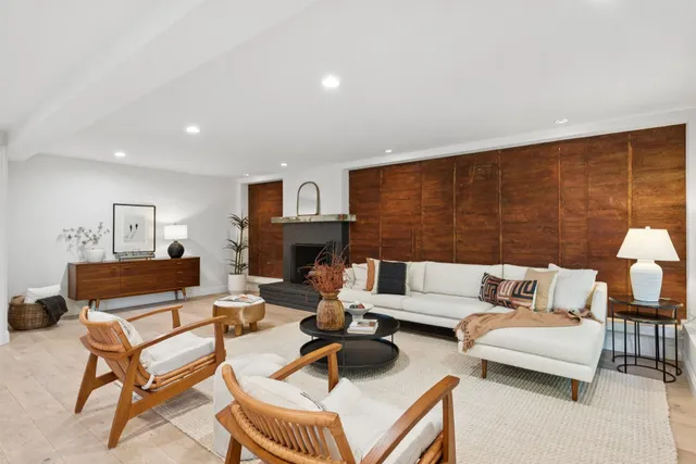 a bathroom with a sink mirror and shower