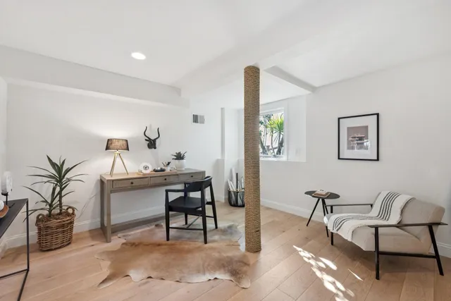 a view of a patio with couches and a fire pit